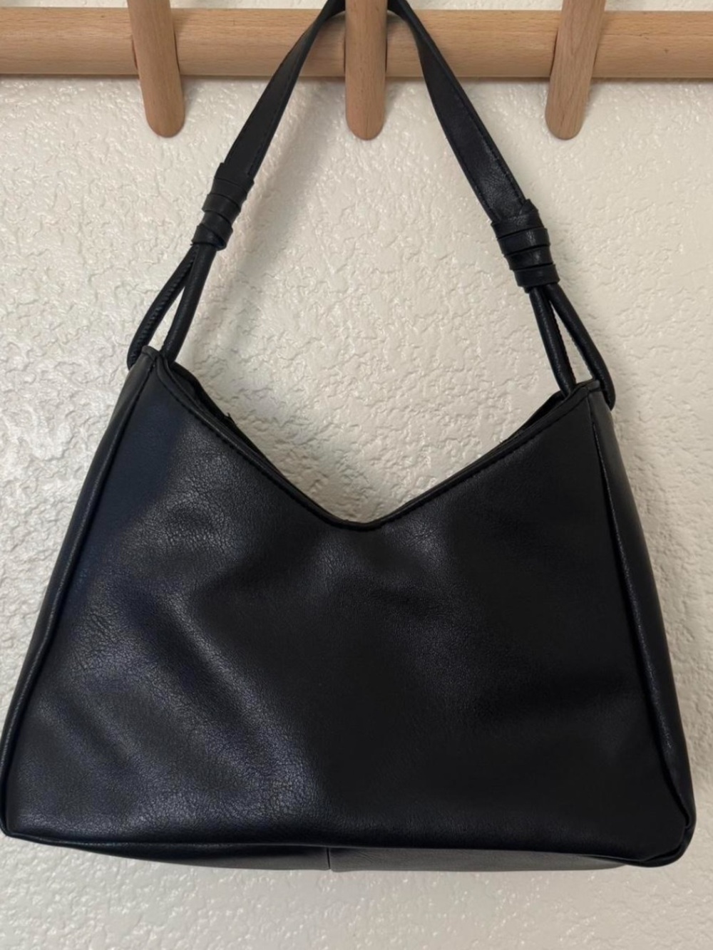Black shoulder bag with removal cross body strap